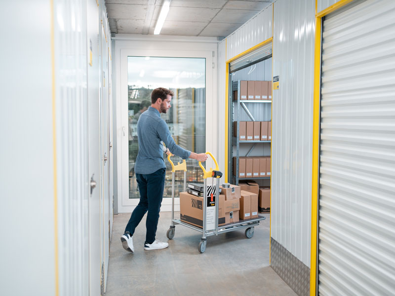 Man stores goods in company warehouse